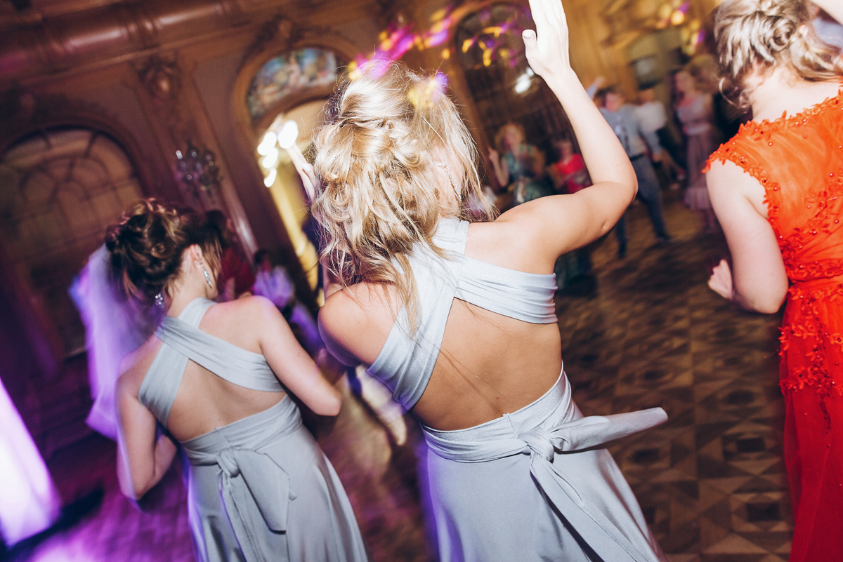 Happy Stylish People Dancing and Having Fun at Wedding Reception